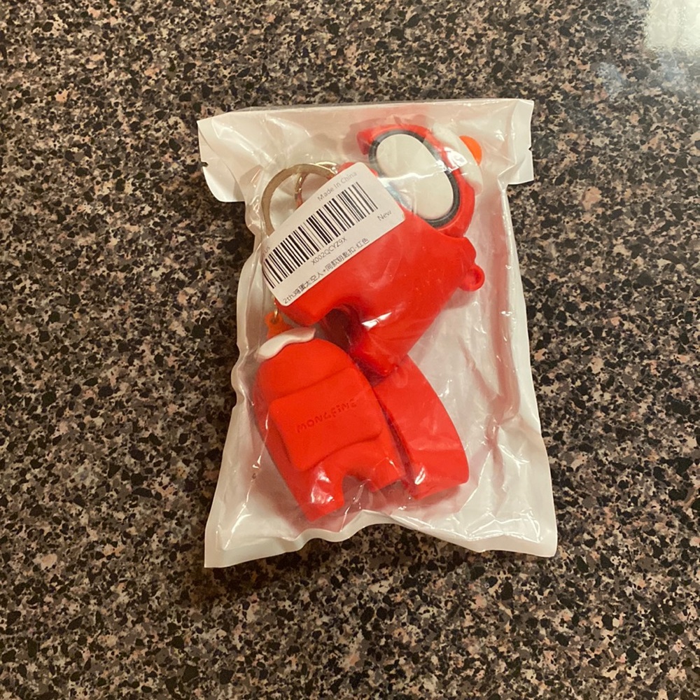 Come one, come all! Amongst Us fans AirPods case with keychain